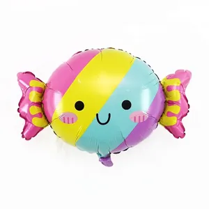 Mignon ballon en aluminium en forme de bonbon avec rayures colorées et motif de visage souriant