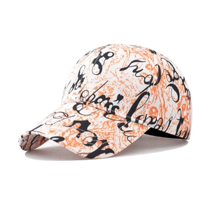 Detail of white baseball cap with orange marble texture and black graffiti style lettering