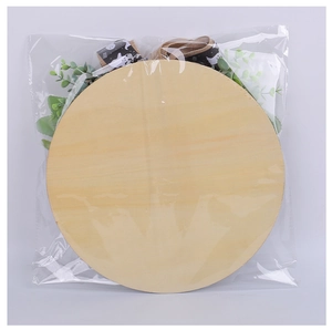 Macro view of a round wooden Halloween door sign with ghost ribbon and eucalyptus detail