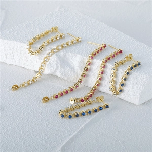 Detail of S925 silver chain earrings with gold plating and colorful crystals
