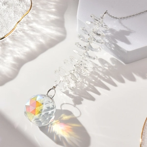 Hanging crystal suncatcher with faceted glass ball and colorful rainbow refraction beads