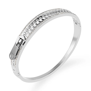 Silver stainless steel zipper bangle with zircon pavé details on a white background
