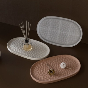 Textured resin oval trays in cream, frosted grey and terracotta for home decor styling