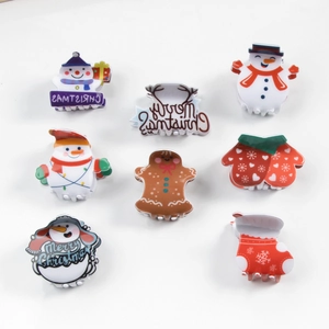 Set of 8 festive Christmas hair claws featuring snowman, reindeer, and gingerbread man designs