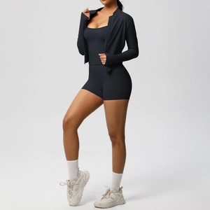 Detailed view of women black three-piece athletic set with high-waist shorts and slim jacket