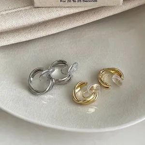 Clips d'oreilles géométriques entrelacés style français en métal doré et argenté