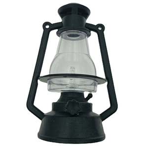 Close-up of black vintage style decorative lantern with clear lampshade and handle