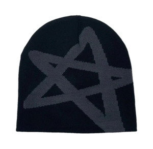Close-up of knitted star pattern on black beanie showing detailed fabric texture