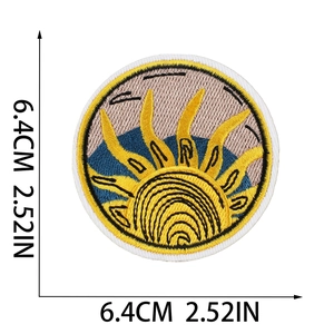 Detail showing embroidered sun and mountain patch with 6.4cm diameter dimensions