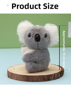 Detail view of a 10cm koala plush keychain showing soft faux fur and dimensions