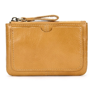Close-up of vintage brown leather wallet showing grain texture and exterior card slot
