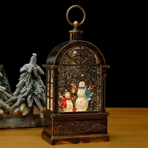 Christmas snowman lantern music box with swirling glitter and warm LED lights