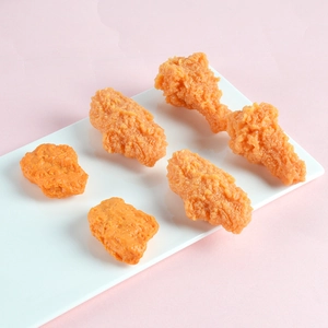 Realistic PVC fried chicken models with crispy texture on white tray for props