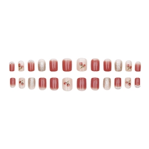 Short square press-on nails with pink gradient, flower art, and pearl accents