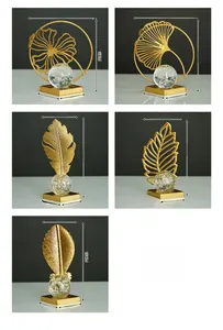 Detailed views of Nordic gold leaf ornaments with crystal balls and square bases