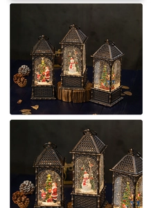 Macro detail of vintage bronze Christmas lantern music box with Santa and glowing LED light