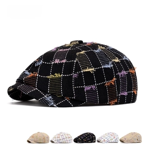 Vintage plaid newsboy cap for women with frayed edges and colorful fringe detail