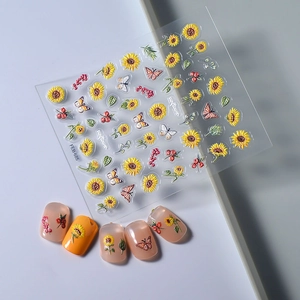 Detailed 3D embossed sunflower and butterfly nail art stickers with textured finish
