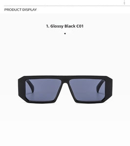 Close-up of bright black rectangular oversized sunglasses with dark grey lenses