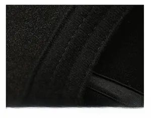 Detail of thickened sweatband and double stitching on the black winter plaid newsboy cap