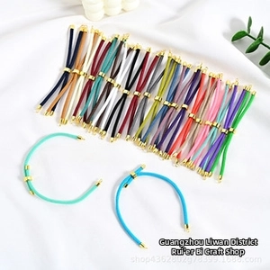 Selection of colorful adjustable steel cord bracelets with gold metal slide buckles