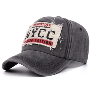 Distressed dark grey vintage baseball cap with embroidered patches and washed cotton texture