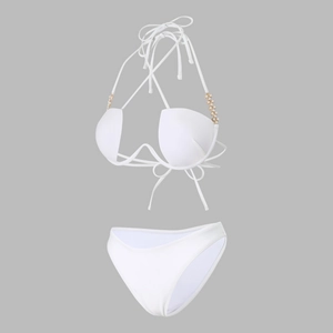 Detail of white bikini set with pearl bead accents and a halter neckline top