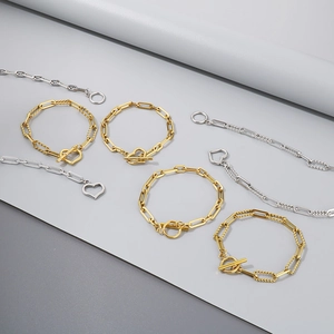 Set gioielli in acciaio inox con catena a O e chiusura a cuore in oro e argento