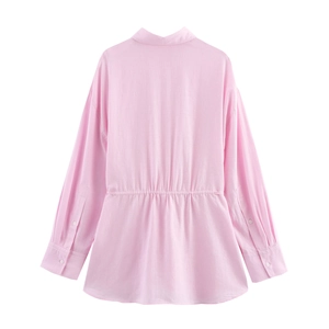 Back view of pink long sleeve shirt with elastic waist detail and linen texture