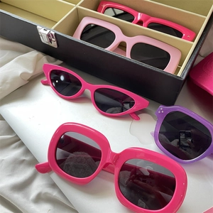 Collection of bold thick-frame sunglasses in vibrant pink and purple stylish colors