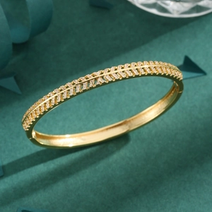 Elegant gold bangle featuring double-row crystal inlay and hollow symmetrical design