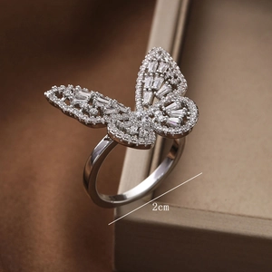 Macro shot of silver butterfly ring with cubic zirconia wings measuring 2cm wide