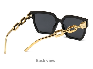 Detail view of large square sunglasses featuring luxury gold chain metal temples on the side