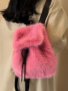 Pink faux fox fur plush backpack with black straps and drawstring for women