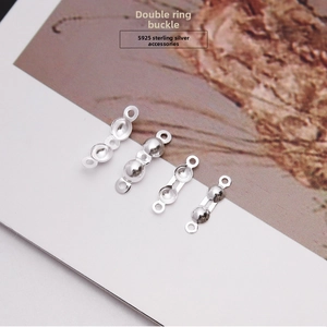 Detailed macro view of S925 sterling silver double-loop clasp jewelry connectors