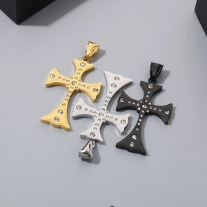 Detailed view of hip hop cross pendants in gold, silver, and black with shiny rhinestones