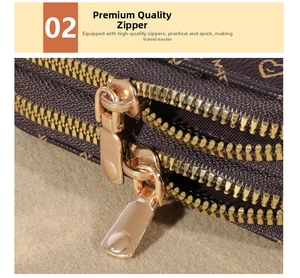 Close-up of durable golden double zippers on a brown embossed leather wallet for women