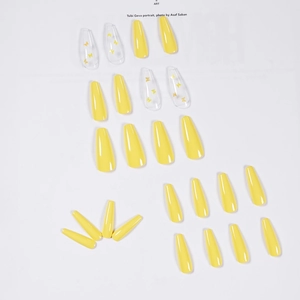 Long ballerina press-on nails with yellow butterfly art and solid bright yellow finish