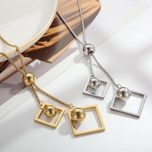 Elegant geometric pendant necklace with gold and silver bead charms on a long metal chain