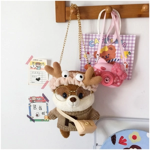 Detailed view of Shiba Inu plush bag with reindeer headband and gold chain strap