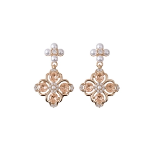 Elegant rose gold flower earrings with champagne crystals and pearls on white background