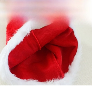 Detail view of reinforced interior stitching and plush trim on red knit Christmas hat