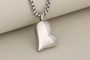 Polished heart cremation pendant in silver stainless steel with box chain detail