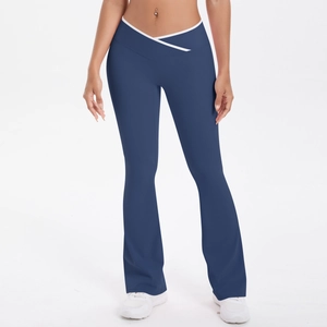 Detail of high-waist flared yoga pants featuring cross-over waist and white trim