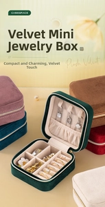 Macro detail of plush velvet jewelry boxes showing interior necklace hooks and ring slots