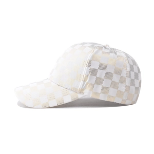 Classic baseball cap with white and gold checkerboard pattern and metallic finish