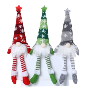 Three Christmas knitted gnome plush dolls with long legs and glowing star hats
