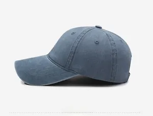 Side view detail of a washed denim baseball cap with vintage distressed texture