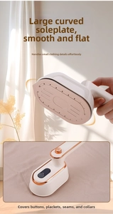 Detail view of the arched ceramic soleplate on portable handheld steamer for clothes