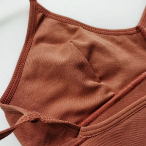 Seamless brown ribbed cotton sports bra with low back design and U-neck silhouette